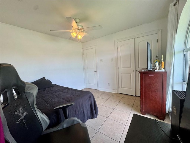 3509 Decomine Dr, Chalmette, LA 70043 - bedroom featuring light tile patterned floors, ceiling fan, and a closet