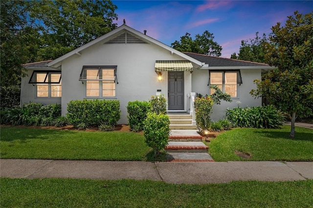 53 Beverly Garden Dr, Metairie, LA 70001 - bungalow featuring a front yard and stucco siding
