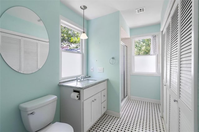 53 Beverly Garden Dr, Metairie, LA 70001 - bathroom featuring a closet, vanity, a shower stall, and tile patterned floors