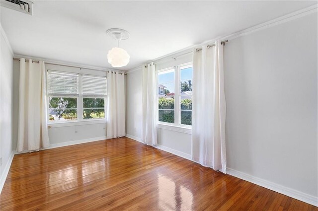 53 Beverly Garden Dr, Metairie, LA 70001 - spare room with plenty of natural light, wood finished floors, and crown molding