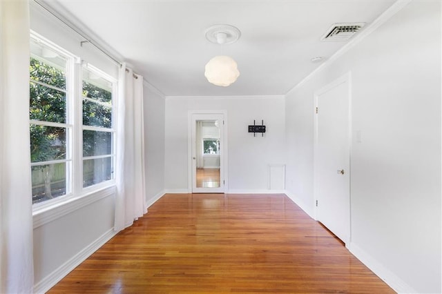 53 Beverly Garden Dr, Metairie, LA 70001 - corridor with wood finished floors and crown molding