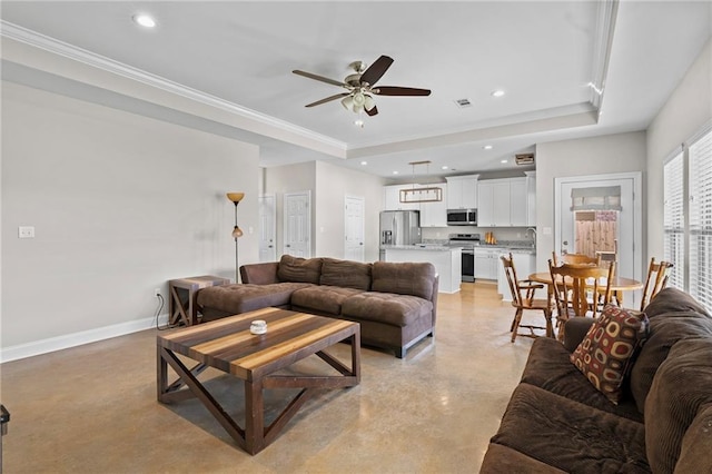 12464 Morgan Creek Ln Unit A, Hammond, LA 70403 - living room featuring a tray ceiling, concrete floors, ceiling fan, recessed lighting, and ornamental molding