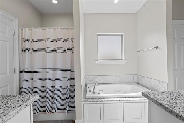 12464 Morgan Creek Ln Unit A, Hammond, LA 70403 - full bathroom featuring a garden tub, vanity, a shower with shower curtain, and recessed lighting