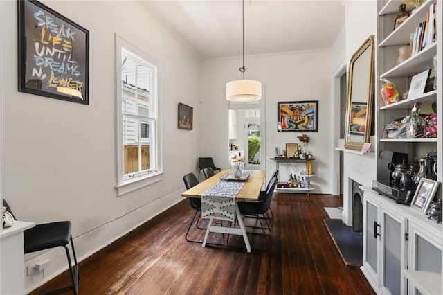 1123 Cadiz St, New Orleans, LA 70115 - dining area featuring plenty of natural light, dark wood finished floors, and crown molding