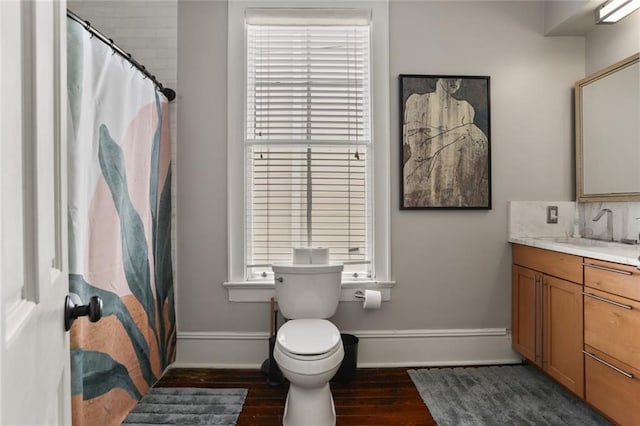 1123 Cadiz St, New Orleans, LA 70115 - bathroom featuring vanity, wood finished floors, a shower with shower curtain, and tasteful backsplash