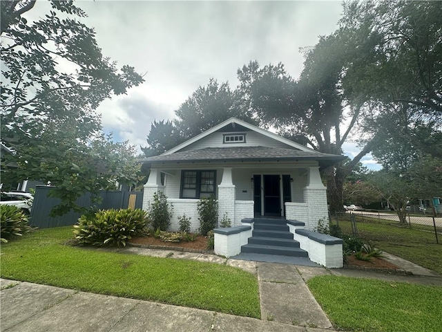 1401 Jefferson St, Gretna, LA 70053 - view of front of property with covered porch, brick siding, and a shingled roof