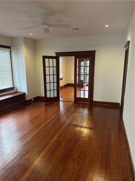 1401 Jefferson St, Gretna, LA 70053 - spare room with french doors, wood finished floors, a ceiling fan, and recessed lighting