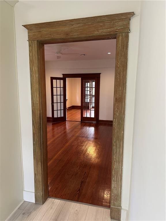 1401 Jefferson St, Gretna, LA 70053 - hall featuring french doors and wood finished floors