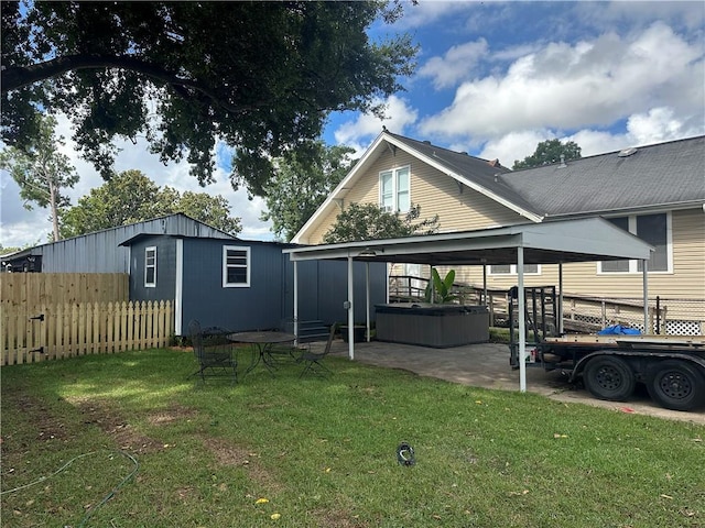 1401 Jefferson St, Gretna, LA 70053 - back of property featuring a hot tub and a patio