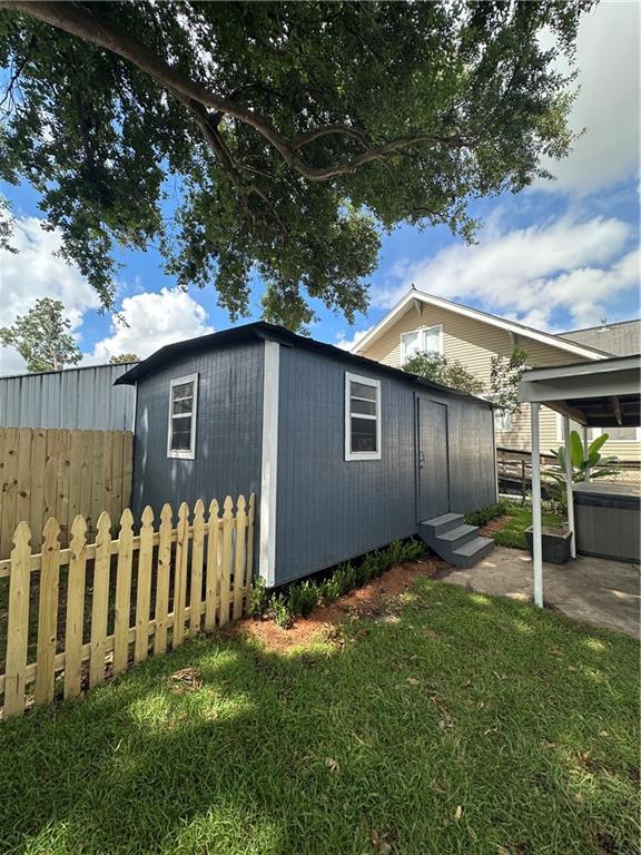 1401 Jefferson St, Gretna, LA 70053 - view of property exterior featuring an outbuilding