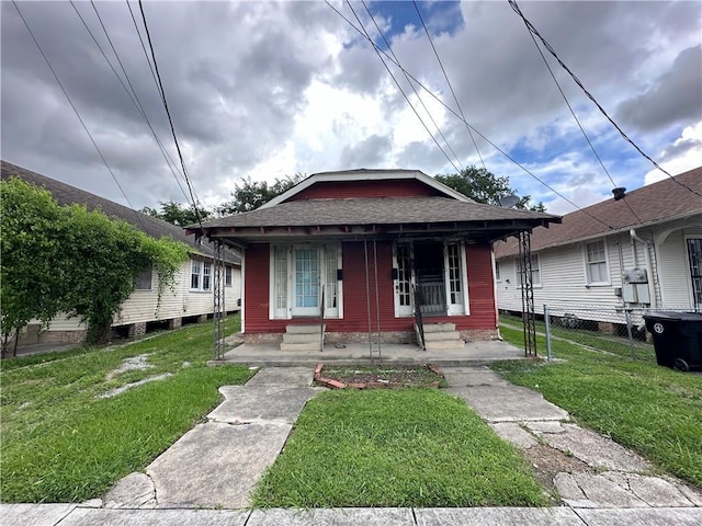 171416 Independence St, New Orleans, LA 70117 - view of front of house featuring covered porch and a shingled roof