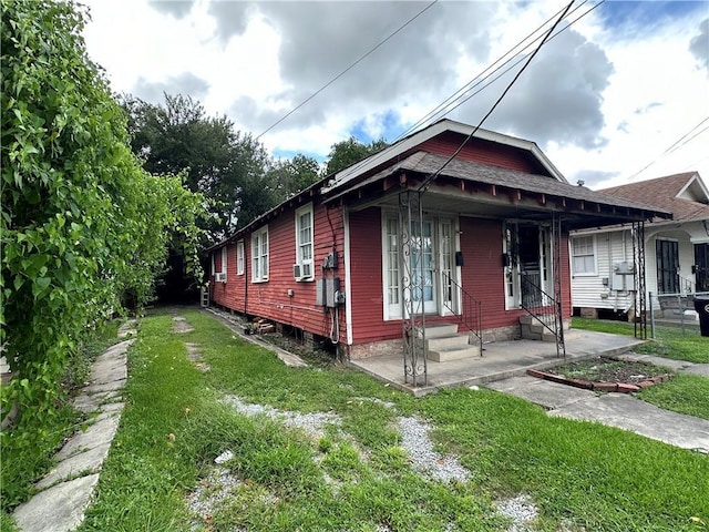 171416 Independence St, New Orleans, LA 70117 - view of front of home featuring entry steps and a front yard