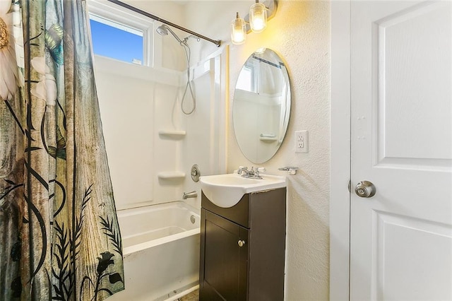 1640 Poland Ave, New Orleans, LA 70117 - bathroom with vanity, shower / bath combination with curtain, plenty of natural light, and a textured wall