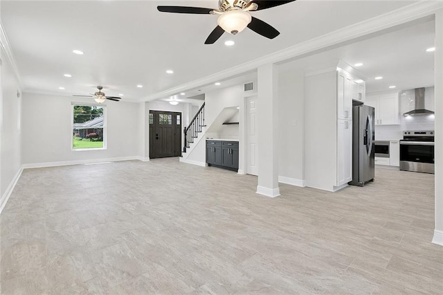 20 Bernice Dr, Luling, LA 70070 - unfurnished living room featuring ceiling fan, ornamental molding, recessed lighting, and stairs