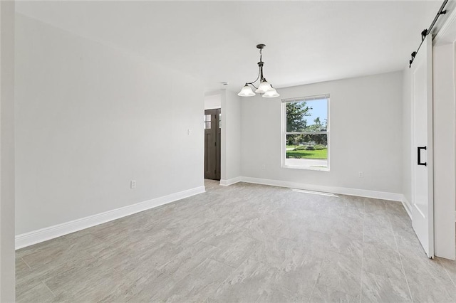 20 Bernice Dr, Luling, LA 70070 - unfurnished room with a barn door and a chandelier