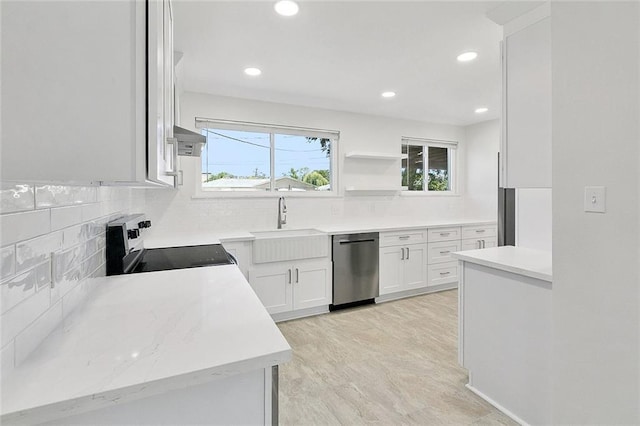 20 Bernice Dr, Luling, LA 70070 - kitchen featuring dishwasher, electric stove, decorative backsplash, white cabinetry, and recessed lighting