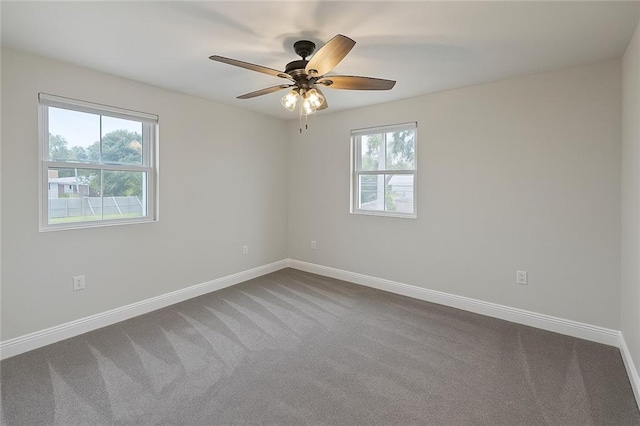 20 Bernice Dr, Luling, LA 70070 - empty room featuring healthy amount of natural light, dark colored carpet, and a ceiling fan
