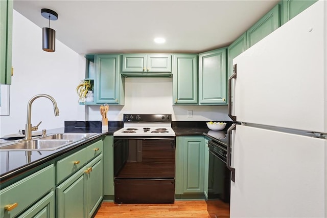 1303 Burgundy St Unit 3, New Orleans, LA 70116 - kitchen featuring freestanding refrigerator, electric stove, and green cabinets