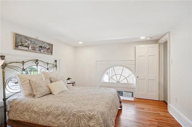 1303 Burgundy St Unit 3, New Orleans, LA 70116 - bedroom with wood finished floors and recessed lighting