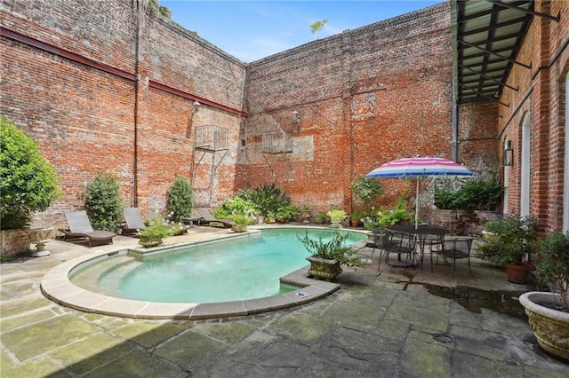 1303 Burgundy St Unit 3, New Orleans, LA 70116 - outdoor pool with a patio area