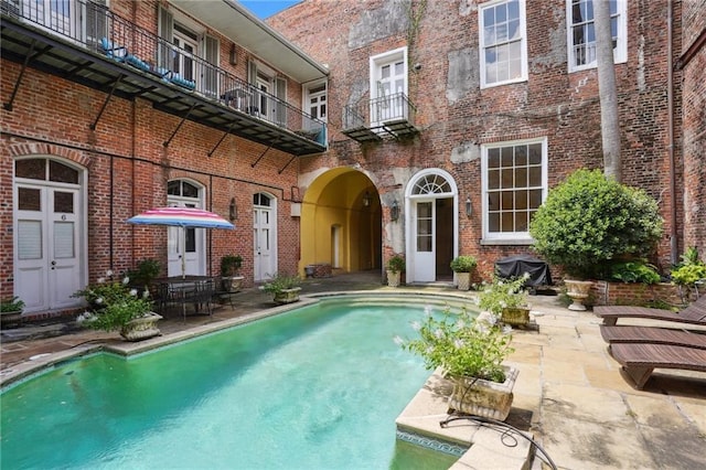 1303 Burgundy St Unit 3, New Orleans, LA 70116 - outdoor pool with a patio