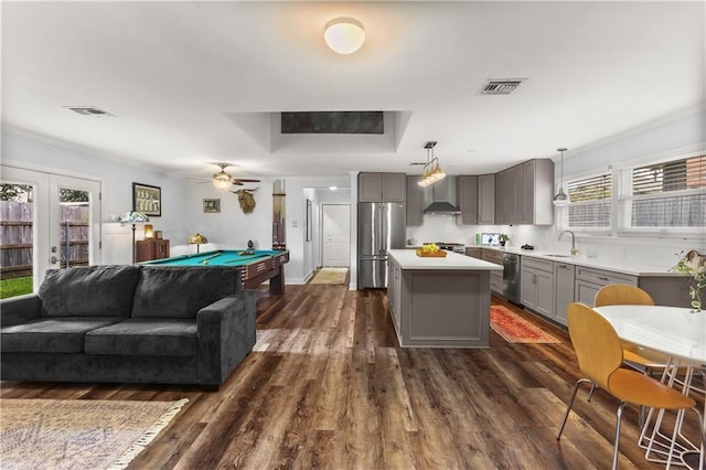 159 Valerie St, River Ridge, LA 70123 - kitchen with stainless steel appliances, gray cabinetry, light countertops, open floor plan, and dark wood finished floors