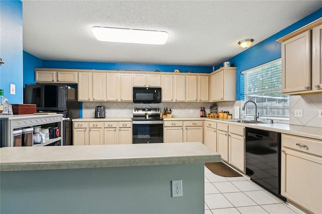3225 Ridgeline Dr, Slidell, LA 70460 - kitchen with black appliances, backsplash, light countertops, light tile patterned floors, and a textured ceiling