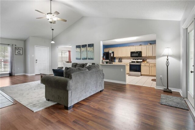 3225 Ridgeline Dr, Slidell, LA 70460 - living room featuring a ceiling fan, high vaulted ceiling, and wood finished floors