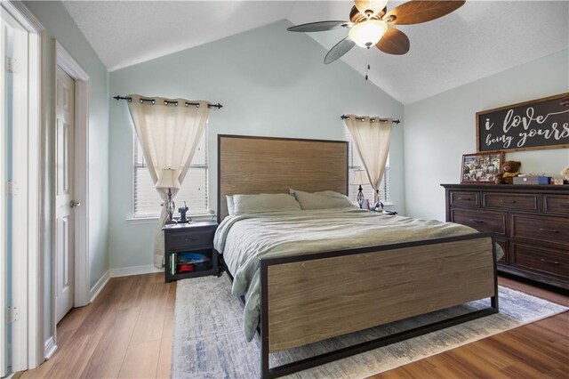 3225 Ridgeline Dr, Slidell, LA 70460 - bedroom featuring lofted ceiling, wood finished floors, and a ceiling fan