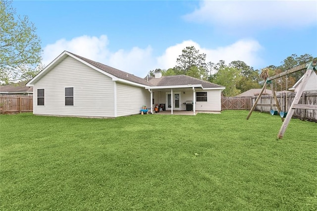 3225 Ridgeline Dr, Slidell, LA 70460 - back of house featuring a patio, a fenced backyard, and roof with shingles