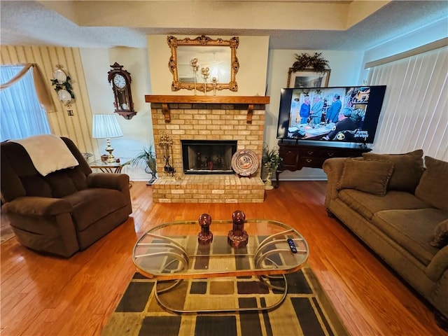 6655 Dalark Dr, Baton Rouge, LA 70812 - living area with wood finished floors and a brick fireplace
