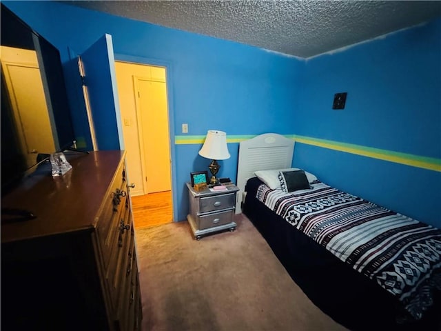 6655 Dalark Dr, Baton Rouge, LA 70812 - carpeted bedroom with a textured ceiling