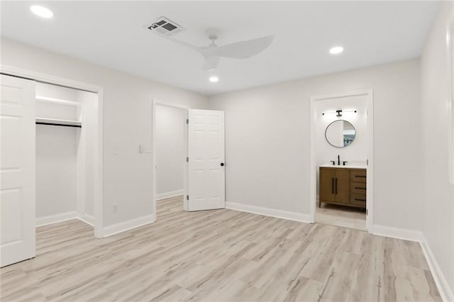 40 Holly Dr, Gretna, LA 70053 - unfurnished bedroom with light wood-style floors, recessed lighting, a closet, ensuite bathroom, and ceiling fan