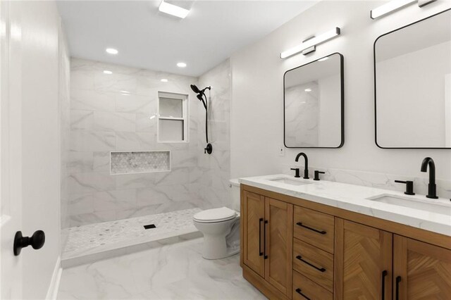 40 Holly Dr, Gretna, LA 70053 - bathroom featuring double vanity, marble finish floors, a marble finish shower, and recessed lighting