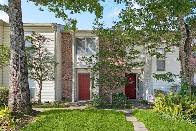 108 Parkview Blvd Unit 108, Mandeville, LA 70471 - multi unit property featuring brick siding and a front lawn