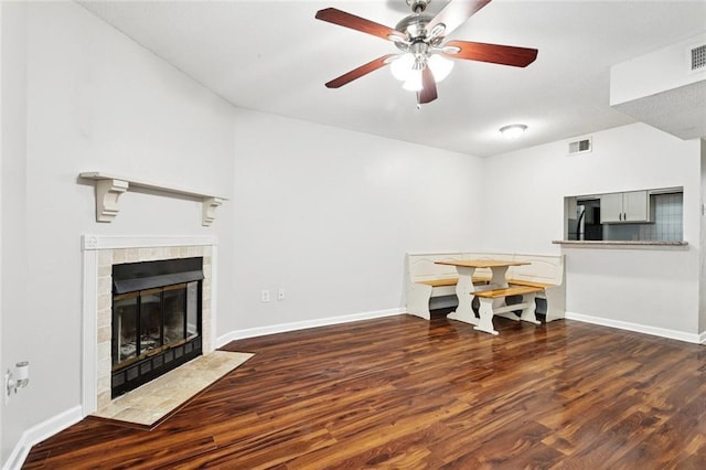 108 Parkview Blvd Unit 108, Mandeville, LA 70471 - unfurnished living room featuring wood finished floors, a ceiling fan, and a tile fireplace