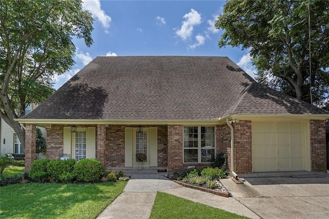 4740 Avron Blvd, Metairie, LA 70006 - view of front facade with brick siding, an attached garage, driveway, roof with shingles, and a porch
