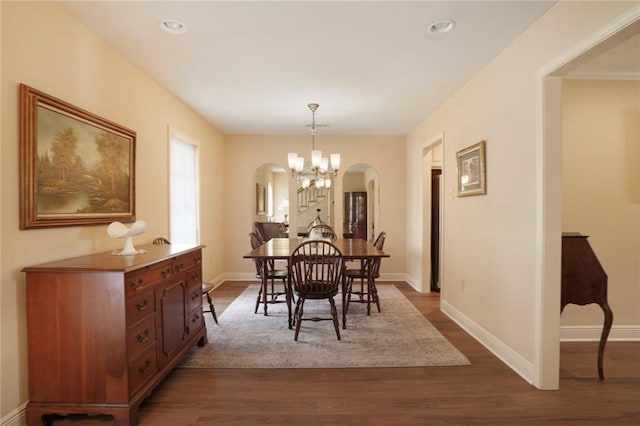 4740 Avron Blvd, Metairie, LA 70006 - dining area featuring arched walkways, dark wood-type flooring, recessed lighting, and a chandelier