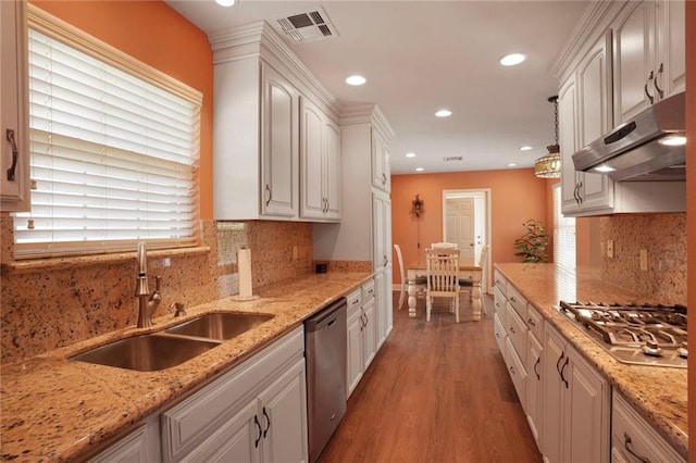 4740 Avron Blvd, Metairie, LA 70006 - kitchen featuring appliances with stainless steel finishes, under cabinet range hood, white cabinetry, light wood-type flooring, and recessed lighting
