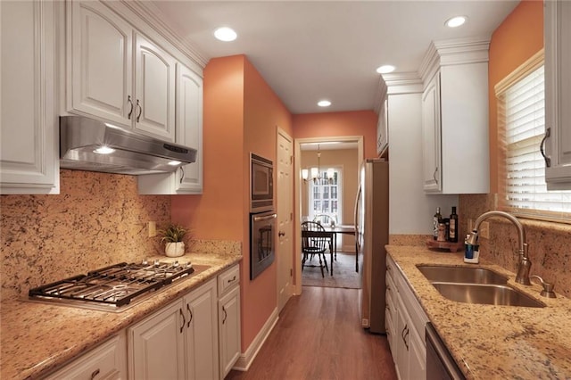4740 Avron Blvd, Metairie, LA 70006 - kitchen featuring under cabinet range hood, appliances with stainless steel finishes, plenty of natural light, white cabinetry, and recessed lighting