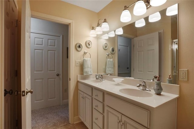 4740 Avron Blvd, Metairie, LA 70006 - bathroom featuring double vanity and baseboards