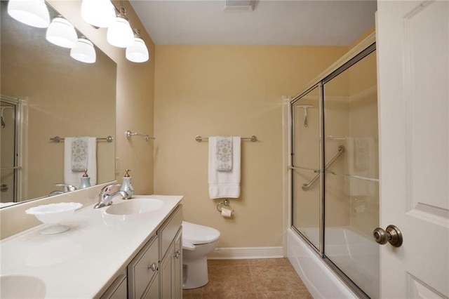 4740 Avron Blvd, Metairie, LA 70006 - bathroom featuring tile patterned flooring, double vanity, and bath / shower combo with glass door