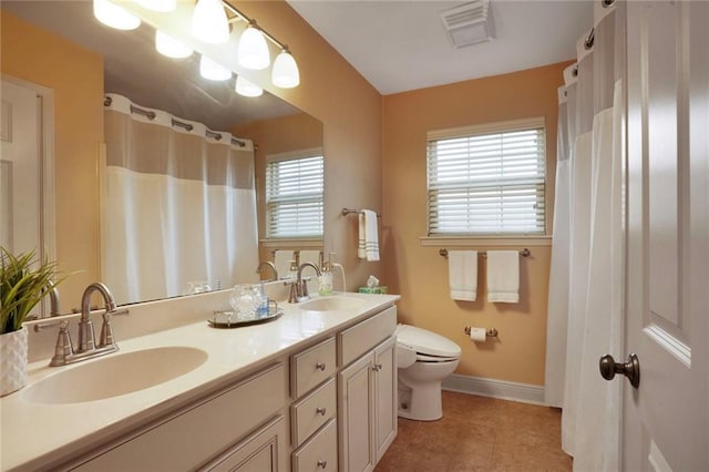 4740 Avron Blvd, Metairie, LA 70006 - bathroom featuring double vanity and tile patterned floors