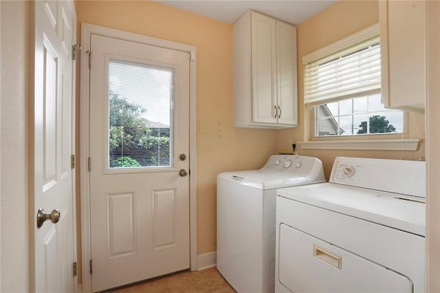 4740 Avron Blvd, Metairie, LA 70006 - laundry area featuring washer and dryer, cabinet space, and plenty of natural light