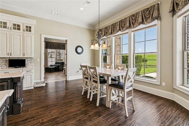 24 Royal Palm Dr, Kenner, LA 70065 - dining room with ornamental molding, dark wood-type flooring, and recessed lighting