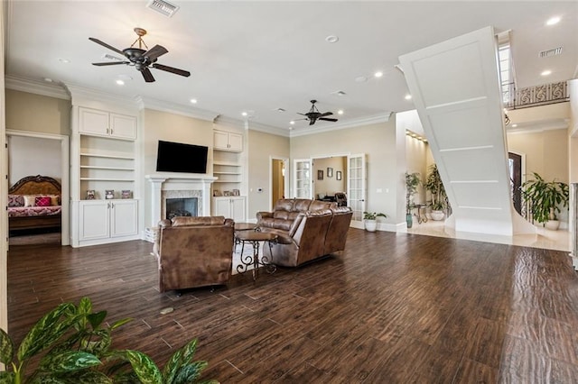 24 Royal Palm Dr, Kenner, LA 70065 - living area featuring a ceiling fan, dark wood-style flooring, a fireplace, recessed lighting, and crown molding