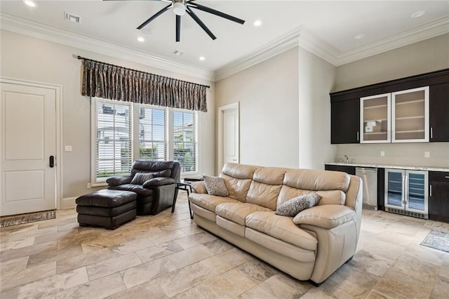 24 Royal Palm Dr, Kenner, LA 70065 - living room with beverage cooler, wet bar, ceiling fan, crown molding, and recessed lighting