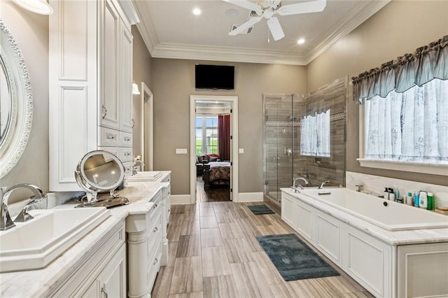 24 Royal Palm Dr, Kenner, LA 70065 - ensuite bathroom with a stall shower, a garden tub, ceiling fan, double vanity, and ornamental molding