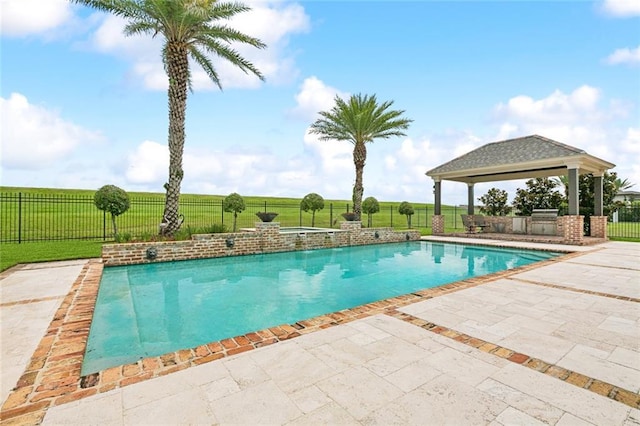 24 Royal Palm Dr, Kenner, LA 70065 - view of pool with a gazebo, a patio, exterior kitchen, and a fenced backyard