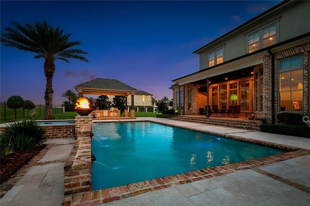 24 Royal Palm Dr, Kenner, LA 70065 - view of swimming pool featuring a patio area, a gazebo, and an in-ground hot tub